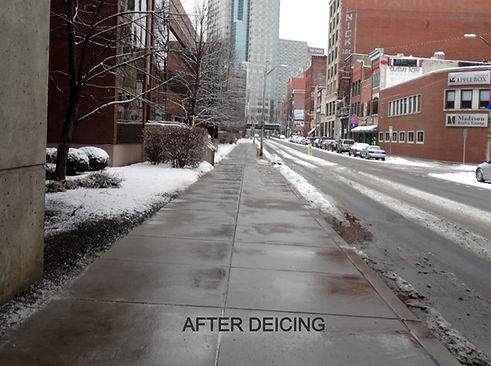 Section of snow covered sidewalk completely cleared after using liquid deicer